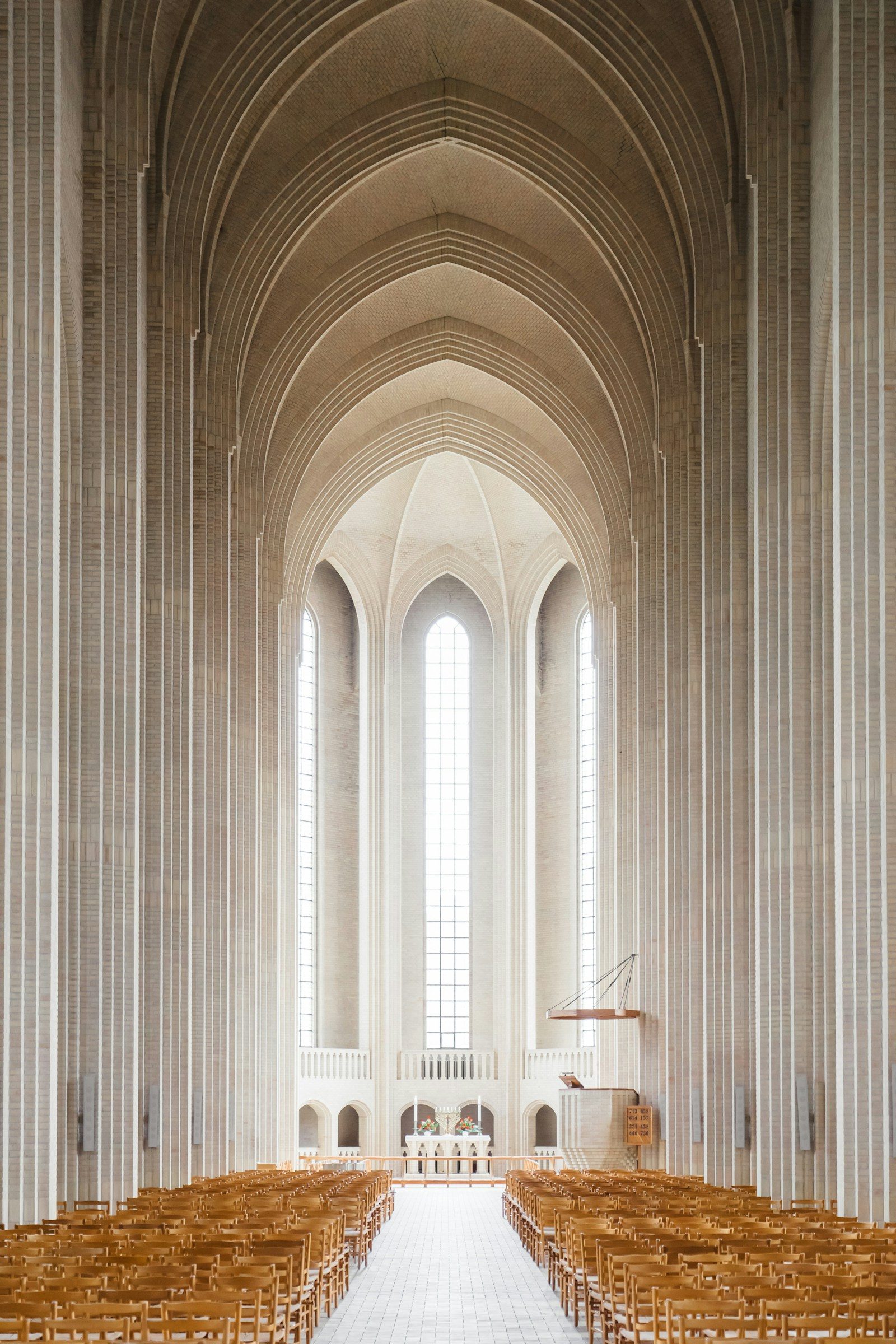 Soft light filling a tall, quiet sanctuary